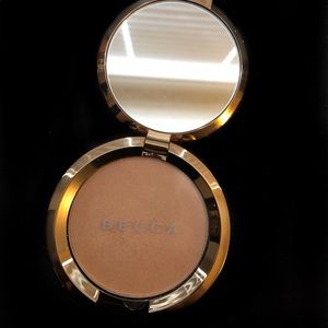 Becca Highlighter Champagne Dream flashes Bellini